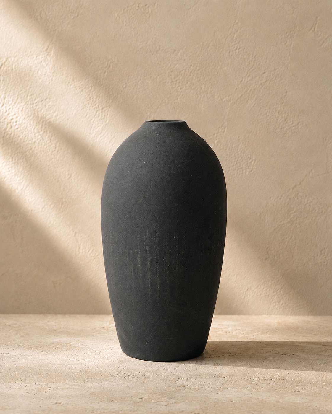 Ashen Stone Vase product image on a warm stone surface
